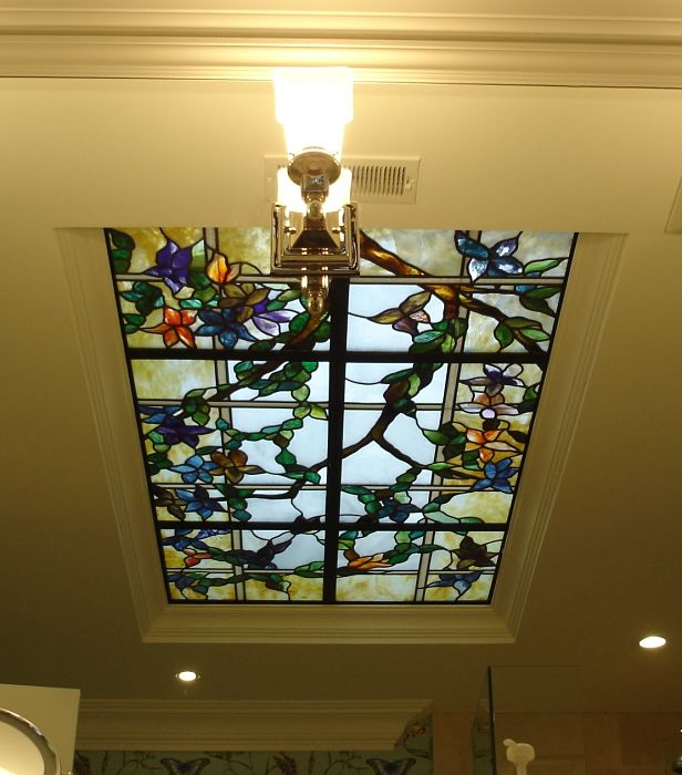 Floral themed stained glass ceiling in a bathroom