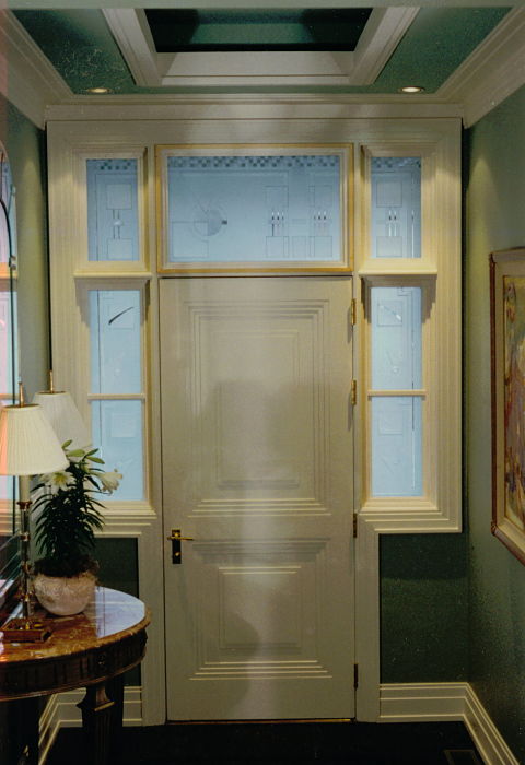 Carved glass sidelights and transom around a front door