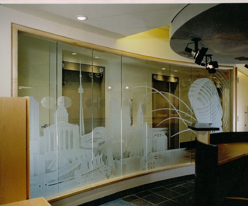Carved glass artwork featuring Canadian landmark buildings