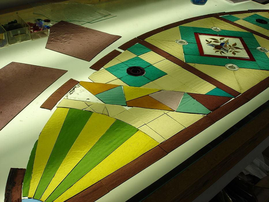 Victorian-era stained glass on a light table