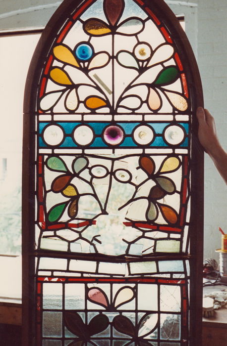 Badly damaged stained glass window