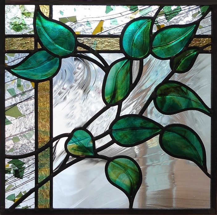 Stained glass with green leaves and trellis design