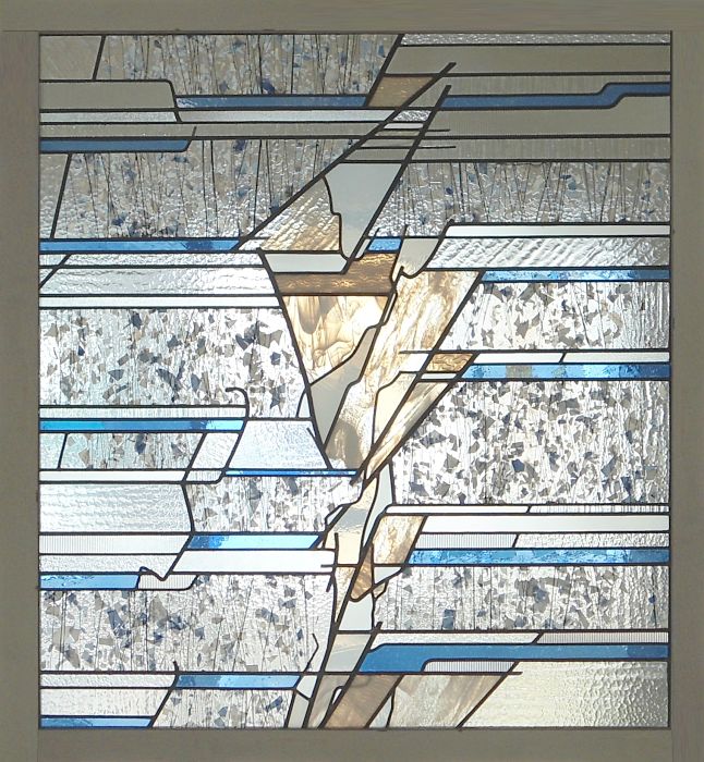 Stained glass window with blue and white glass bands by The Glass Studio