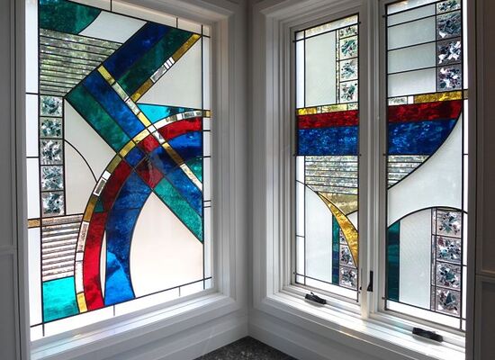Stained glass windows with red, blue and white glass made by The Glass Studio