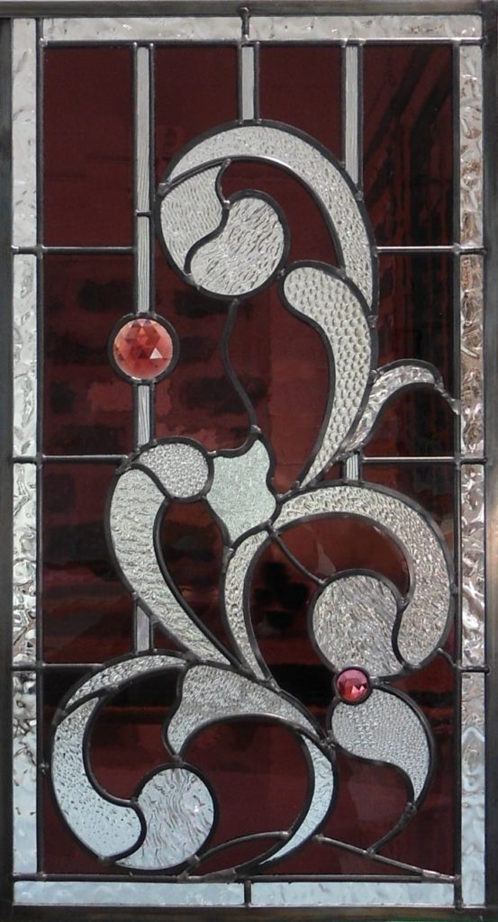 Stained glass window made from purple mouth-blown glass