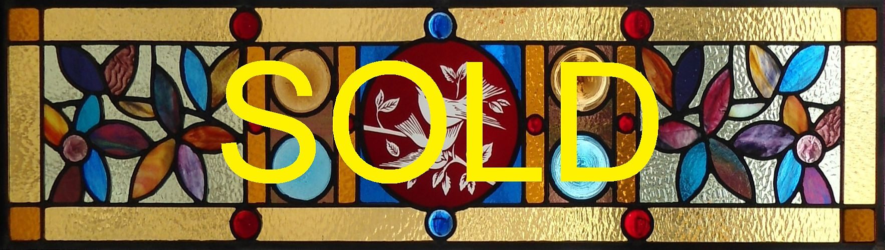 Stained glass window with red flashed glass birds centre by The Glass Studio