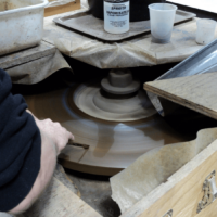 The Glass Studio image 172 - Grinding glass with The Glass Studio's Henry Lange roughing wheel Grinding glass by hand on a cast iron wheel